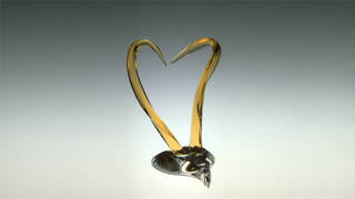 Heart Of Compassion colored glass sculpture by Michael Bokrosh